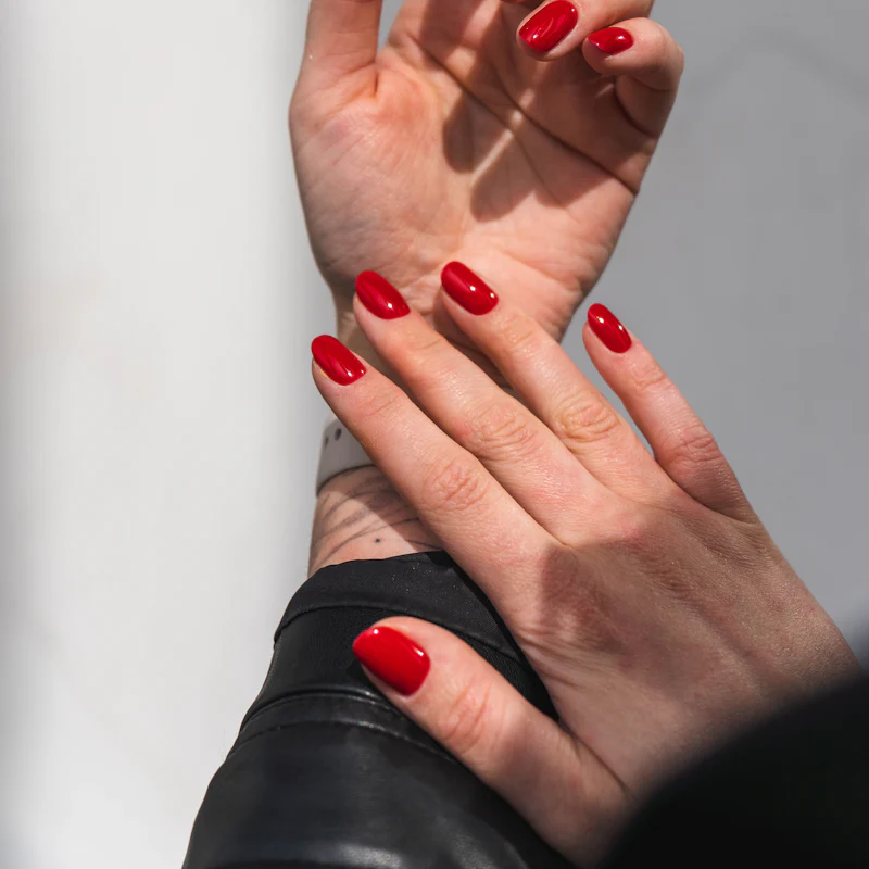 Short square nails in classic red gel