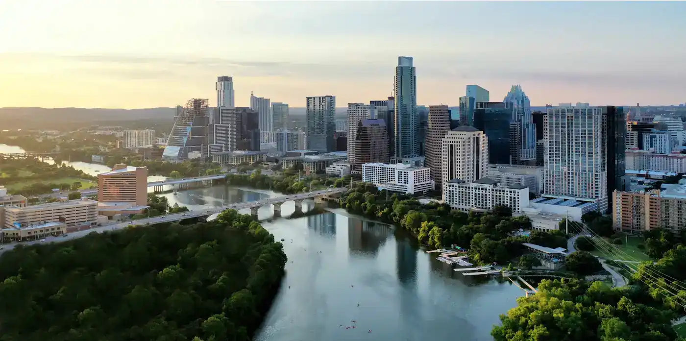 The Austin skyline above Lady Bird Lake and its green riverbanks