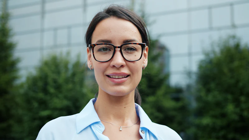 Jess Navarro, lead hygienist, wearing glasses and a light blue shirt
