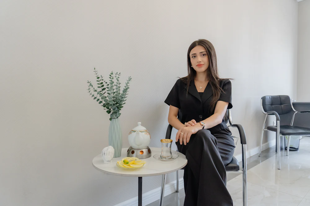 A patient sitting comfortably in the quiet lounge before her appointment