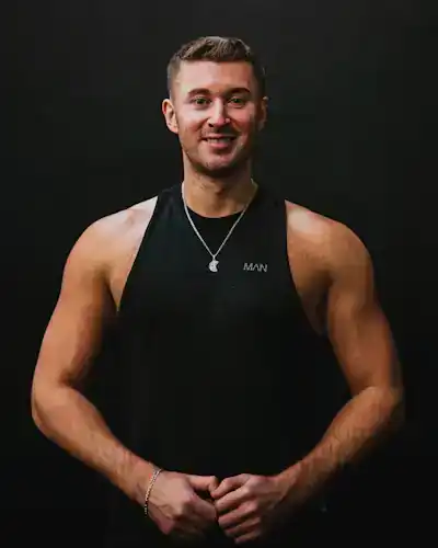 Portrait of coach Marcus Bell in a black tank top